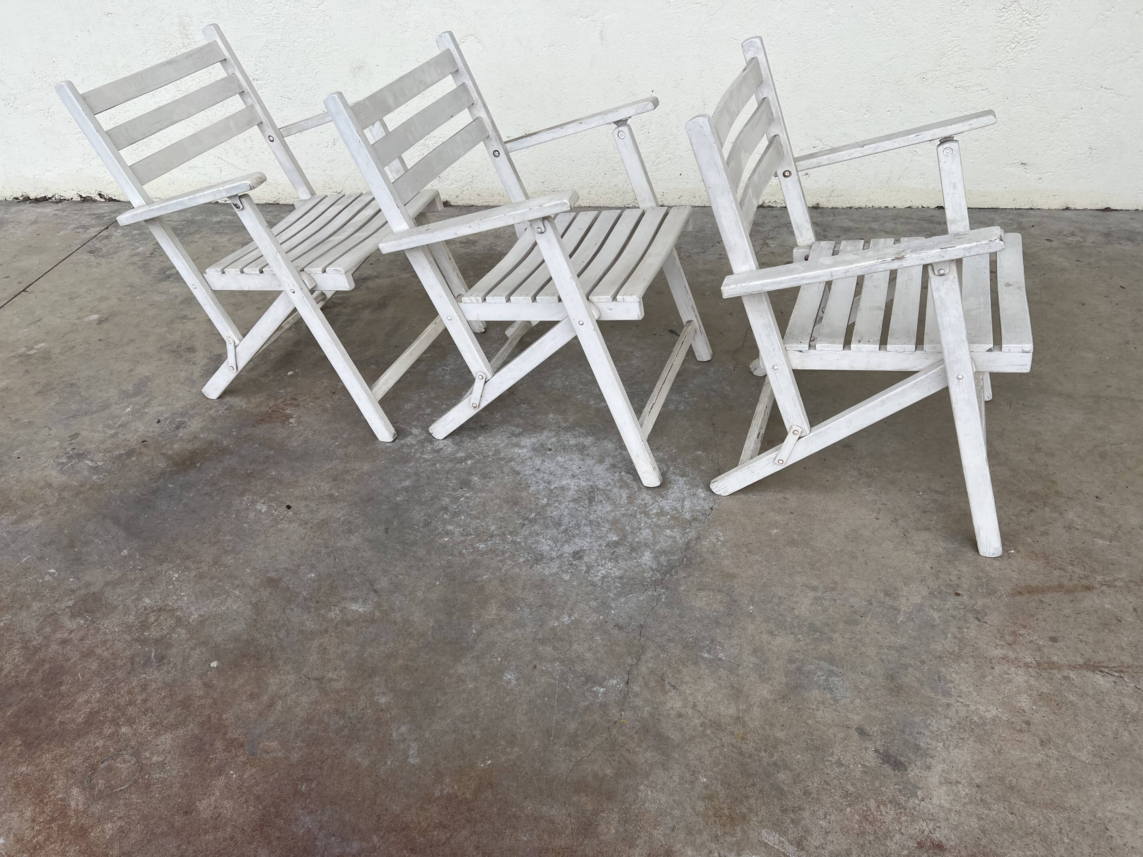 Folding wooden armchairs