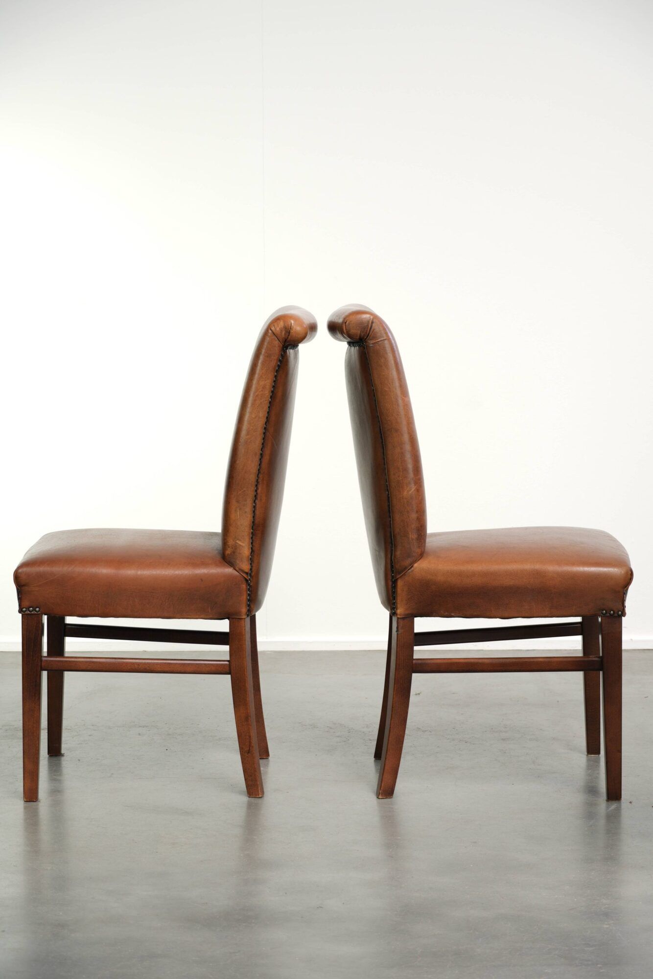 Set of 6 sheepskin dining chairs in a cognac colour with a lovely patina