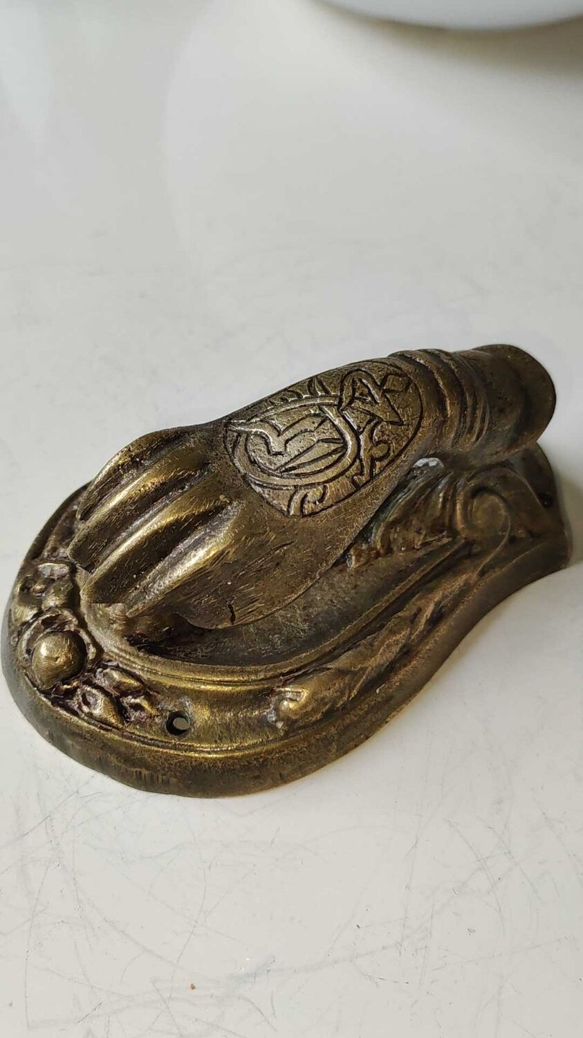 Door knocker in bronze