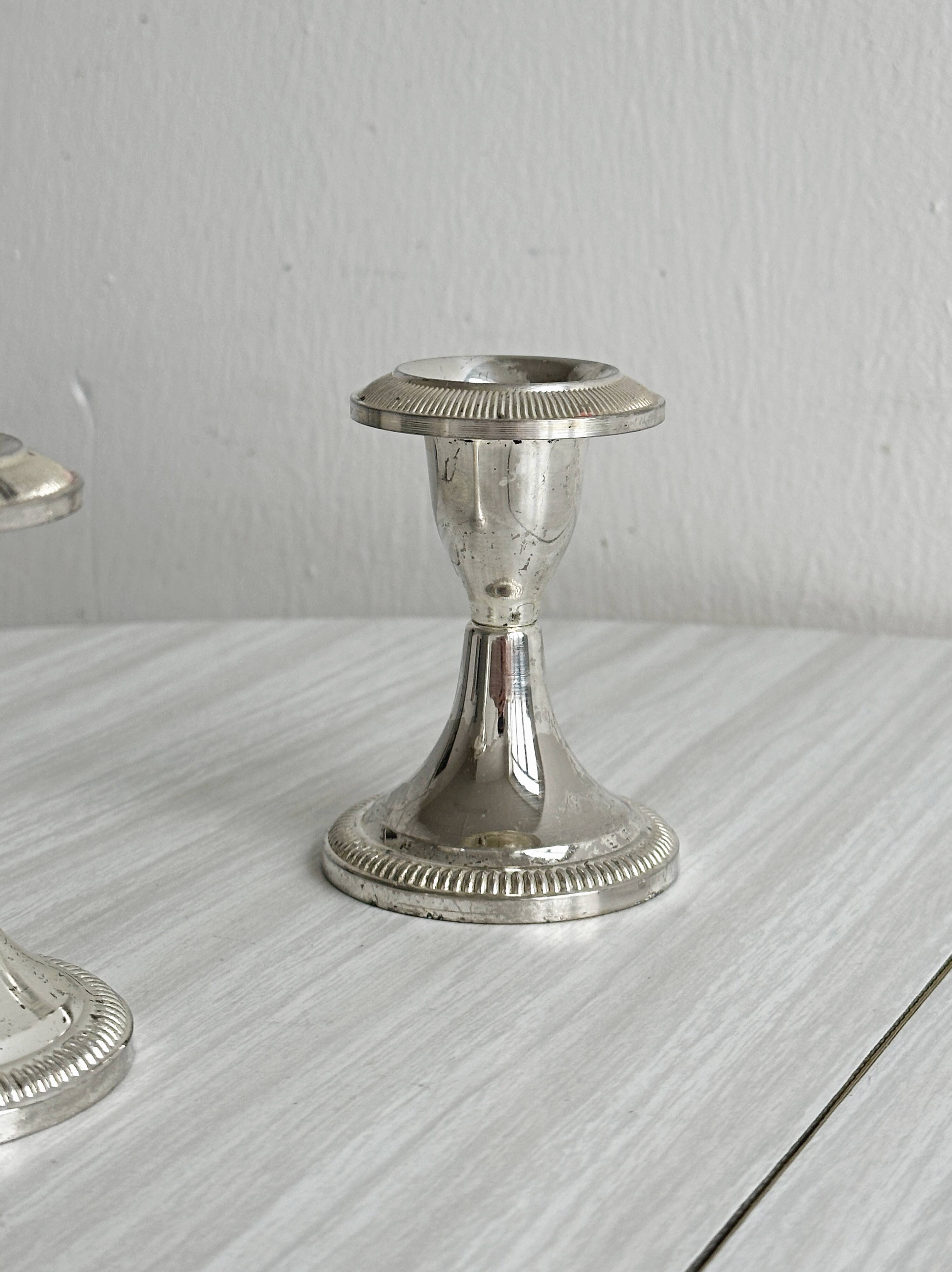 Set of 2 vintage silver-plated metal candle holders.