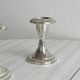 Set of 2 vintage silver-plated metal candle holders.