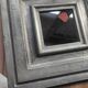Vintage square mirror in wood covered with metal leaf, moldings in relief