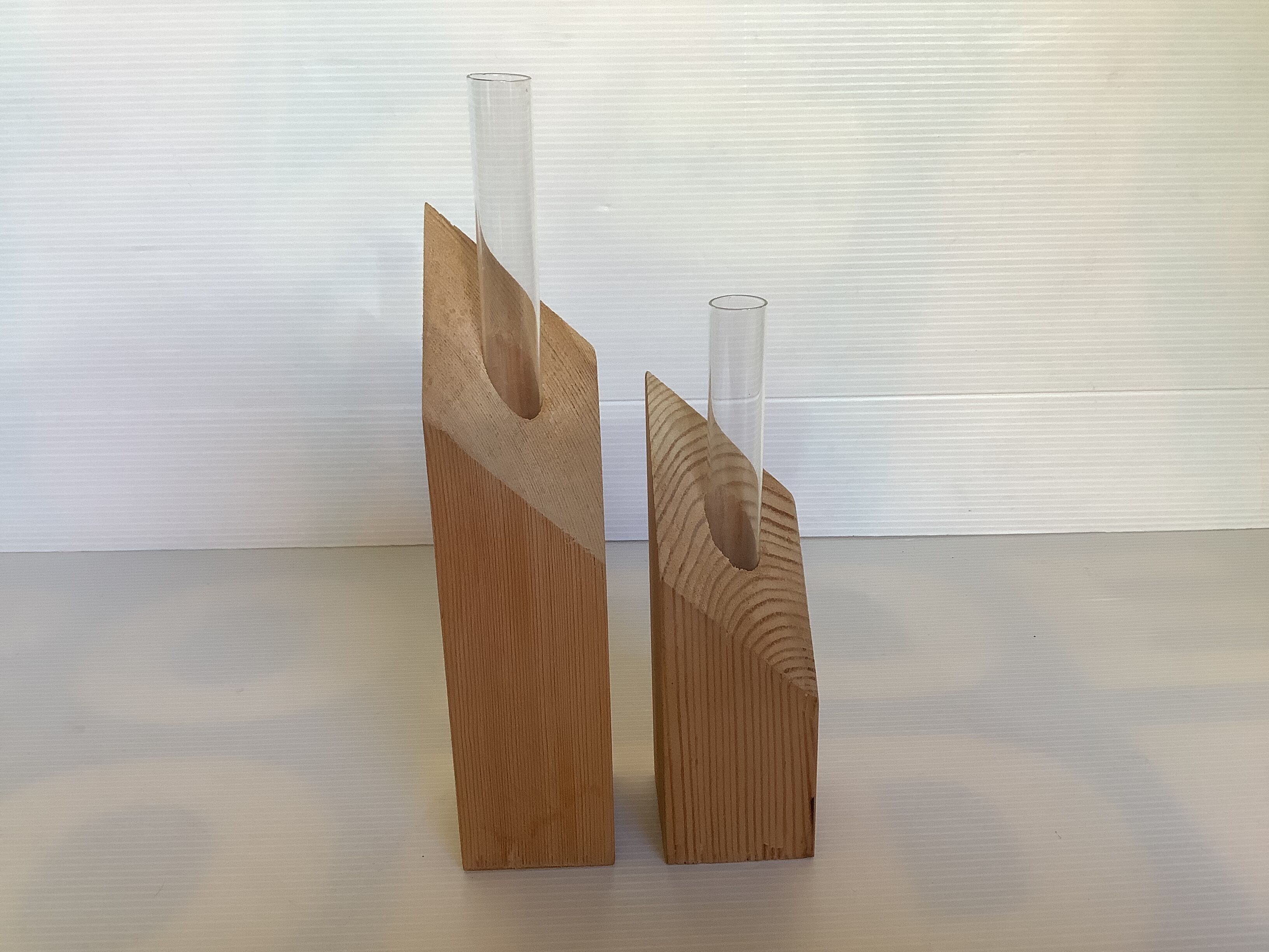Pair of diamond-shaped wooden Scandinavian test tube vases.