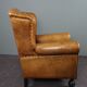 Antique armchair in patinated sheepskin
