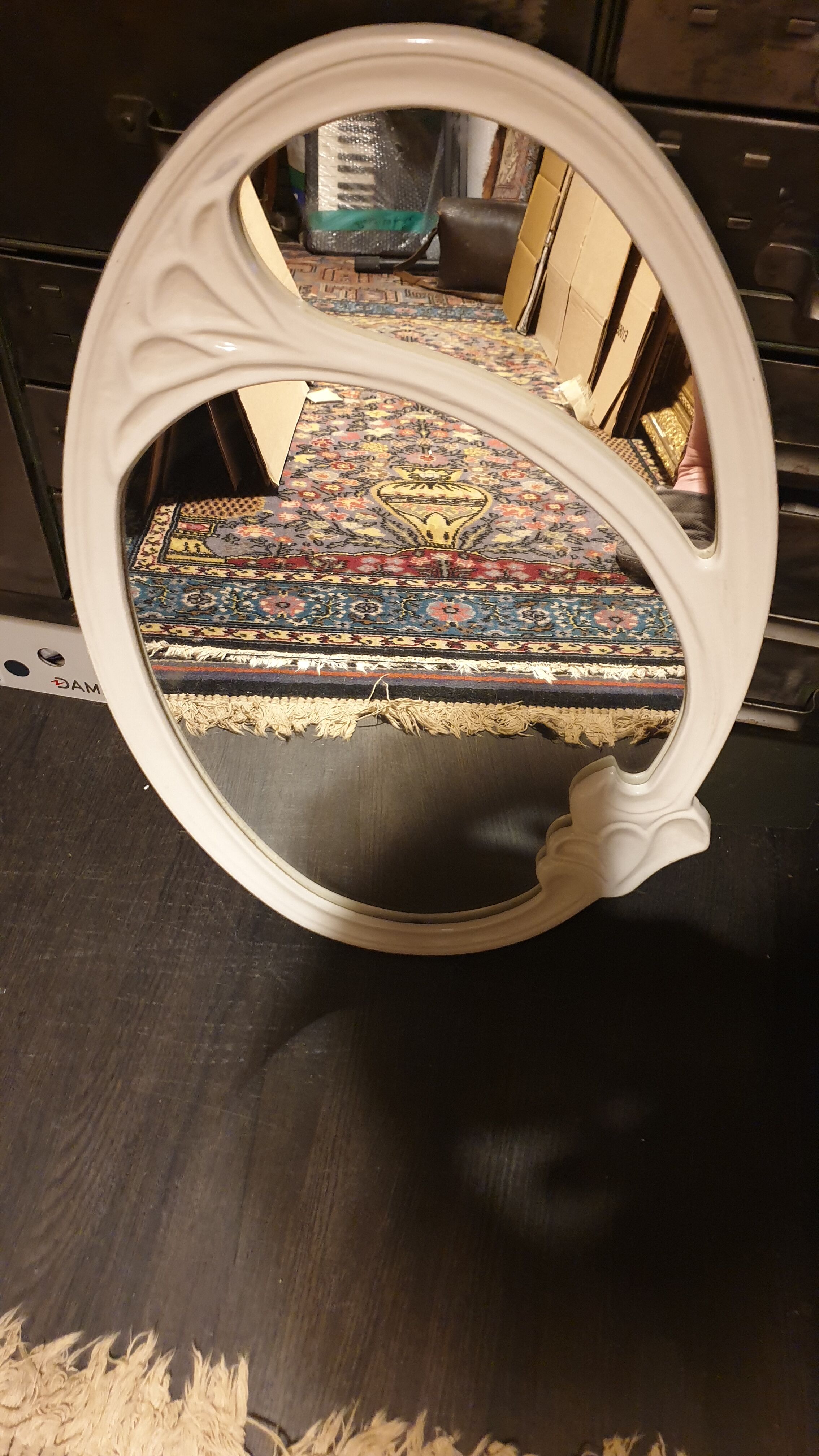 Oval cast iron mirror