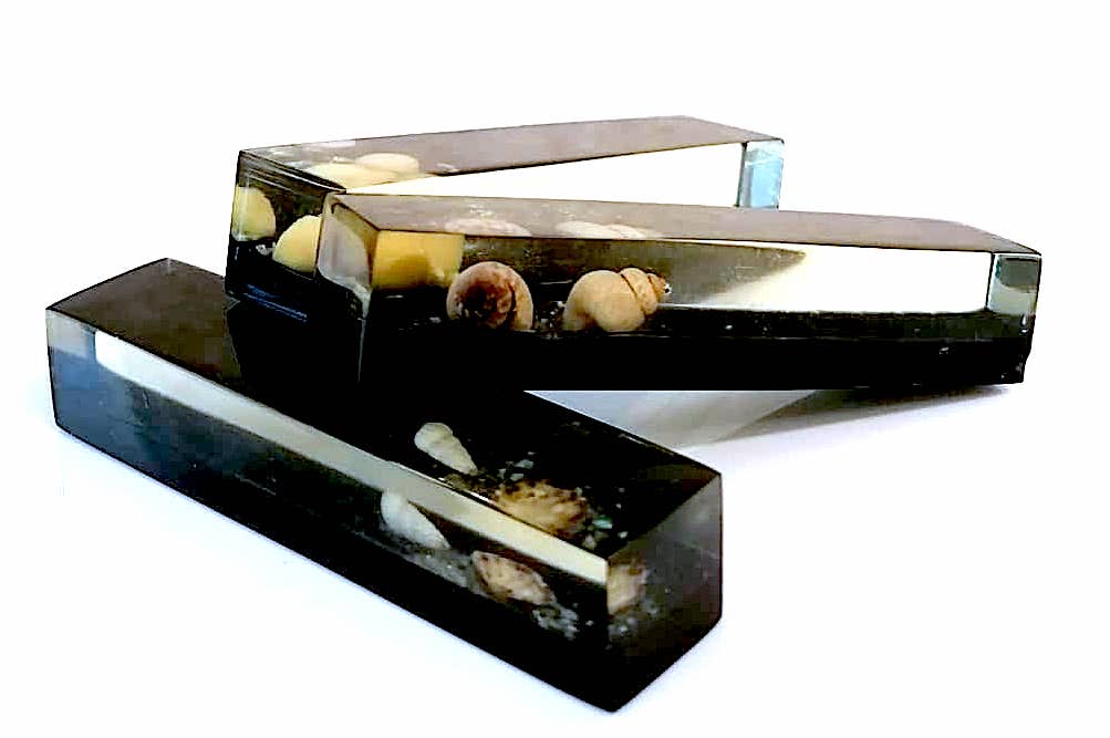 Set of 11 blackened resin knife holders, 1970s