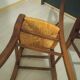 Pair of vintage wooden and woven straw chairs