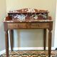 Art Deco console in walnut and marble.