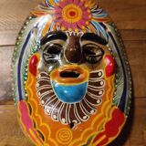 Mexican mask from the 1970s, hand-painted on terracotta.