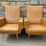 Pair of mustard skaï armchairs, brass feet