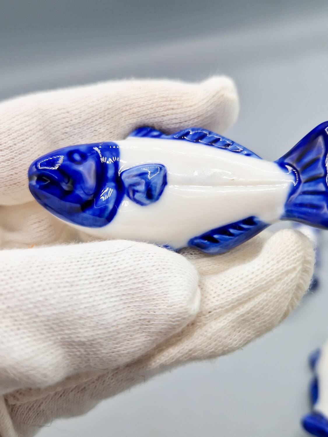 Set of 11 vintage blue and white porcelain fish knife rests.