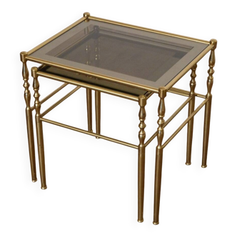 Nested tables in brass and glass from the 1970s.