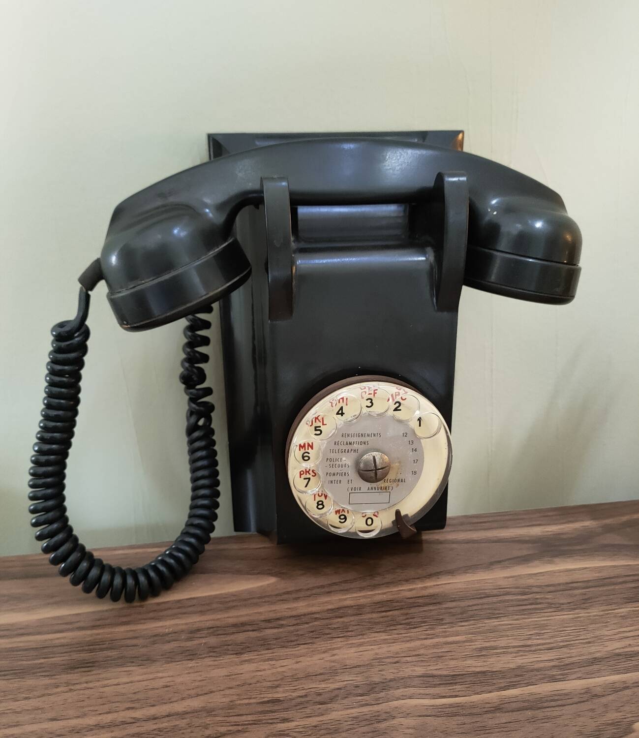 Old bakelite wall telephone
