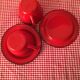 2 cups and their red enamelled saucer