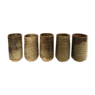Series of five cups in sandstone