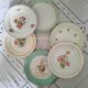 Pitted old flat earthenware plates with gold