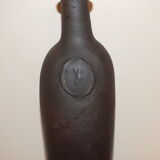Old terracotta bottle with small spout