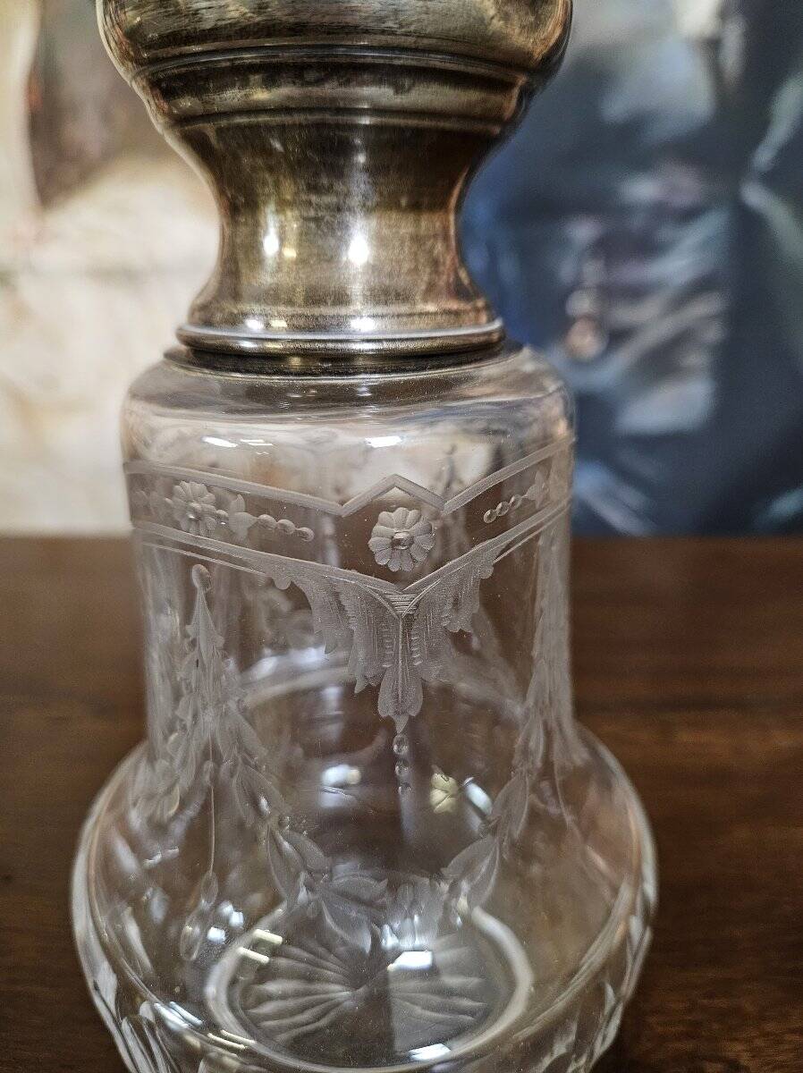 Pair of antique Louis XVI style bottles in finely engraved crystal and silver.