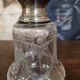Pair of antique Louis XVI style bottles in finely engraved crystal and silver.