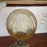 Bronze lamp and amber globe circa 1900
