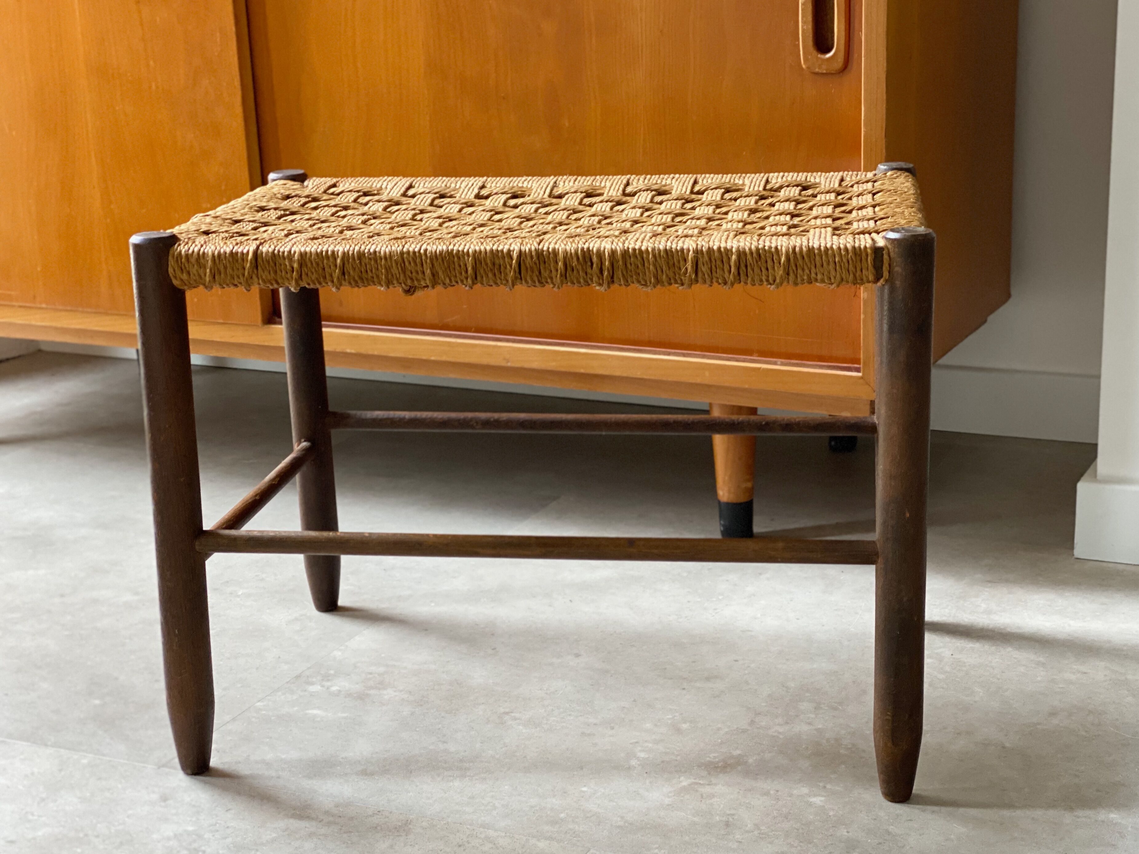 Mid Century wooden stool with a woven sisal seat