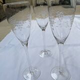 Set of 3 engraved champagne flutes.