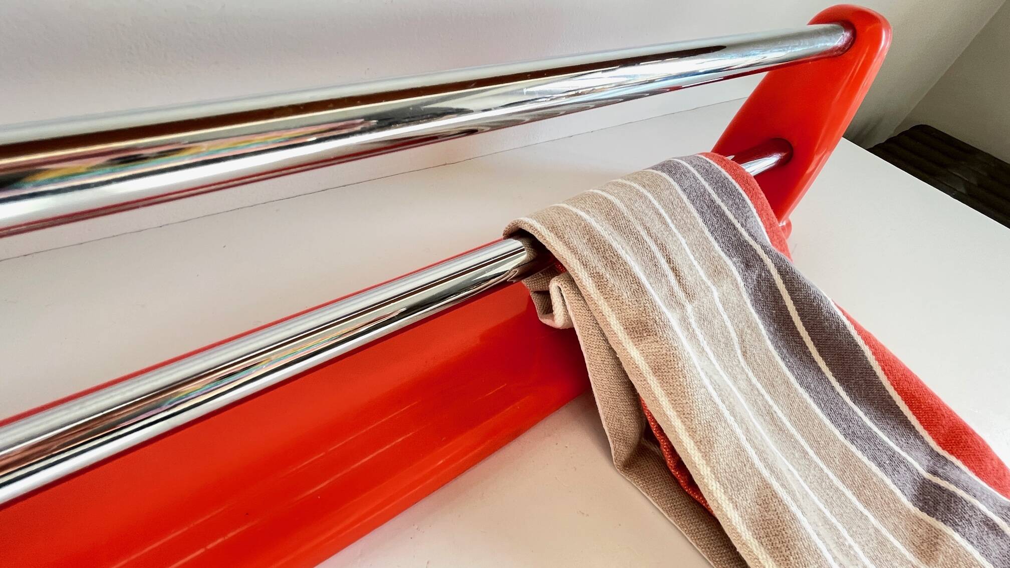 Orange towel rack by Syla from the 70s