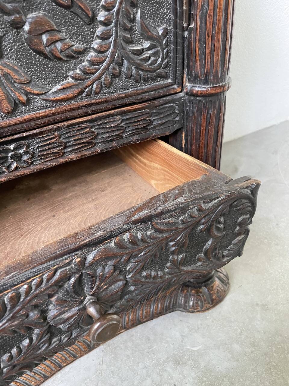 19th century chest of drawers in carved blackened pine