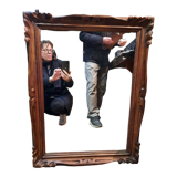 Mirror in golden wood