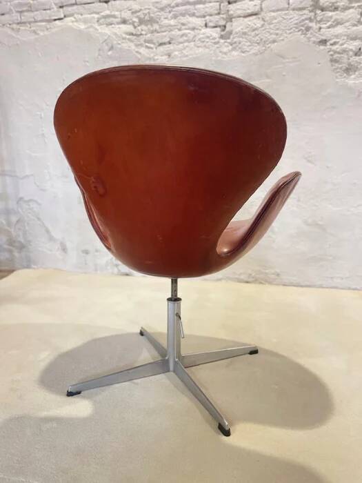 First edition Arne Jacobsen Swan chair, original patinated leather, 1950s
