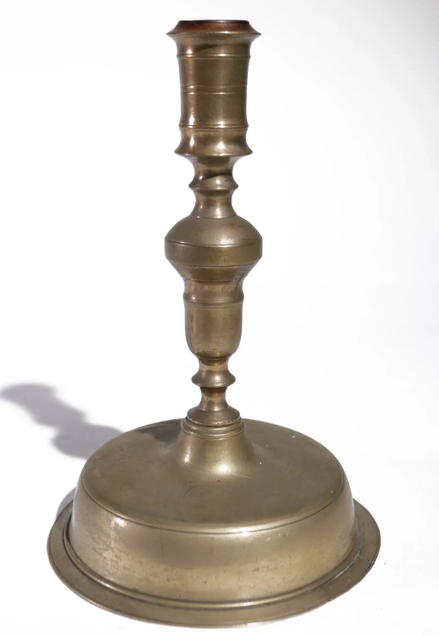 Large Spanish brass candlestick with low bell base – circa 1680-1730