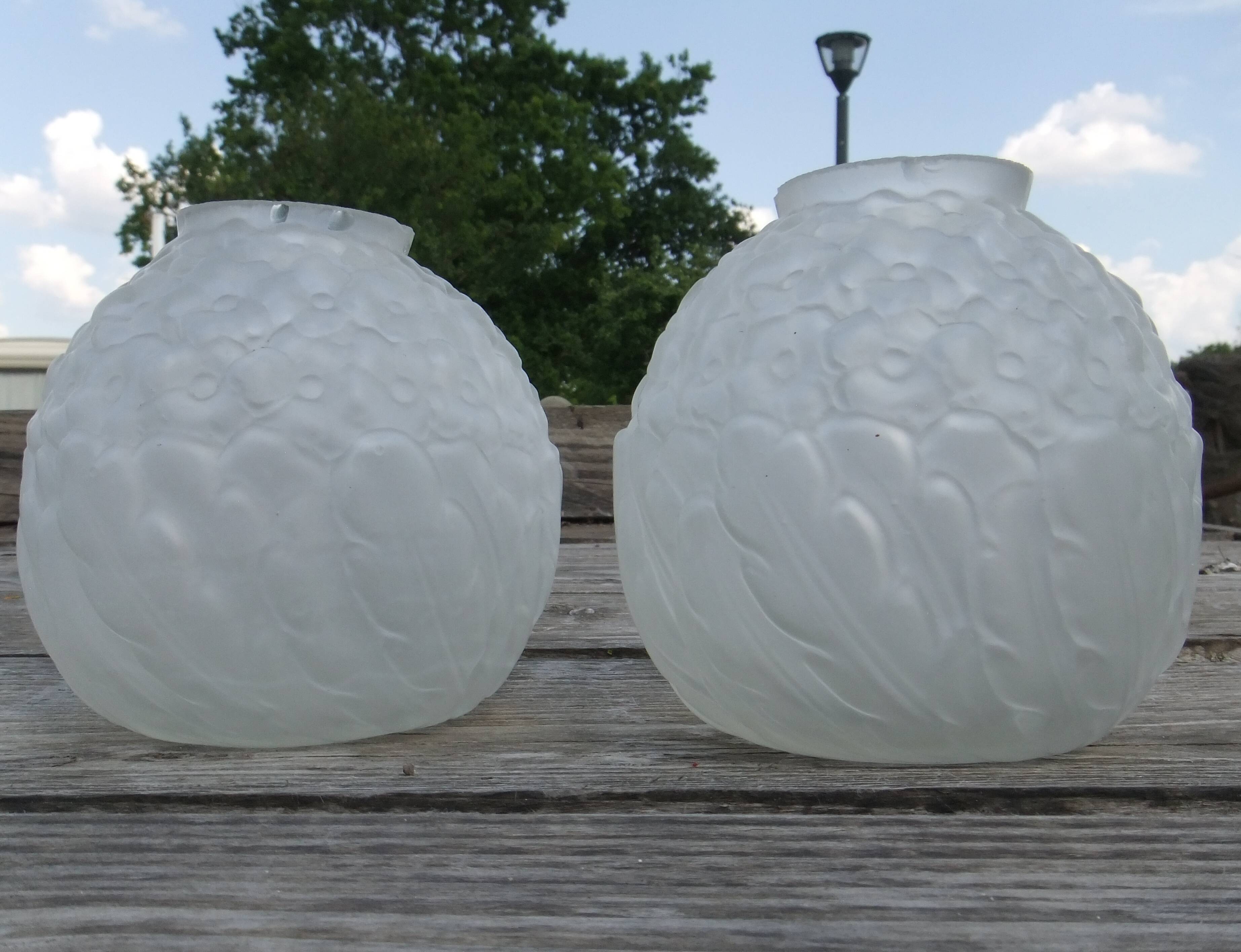 Art Deco ball vase pair with flower and leaf decor