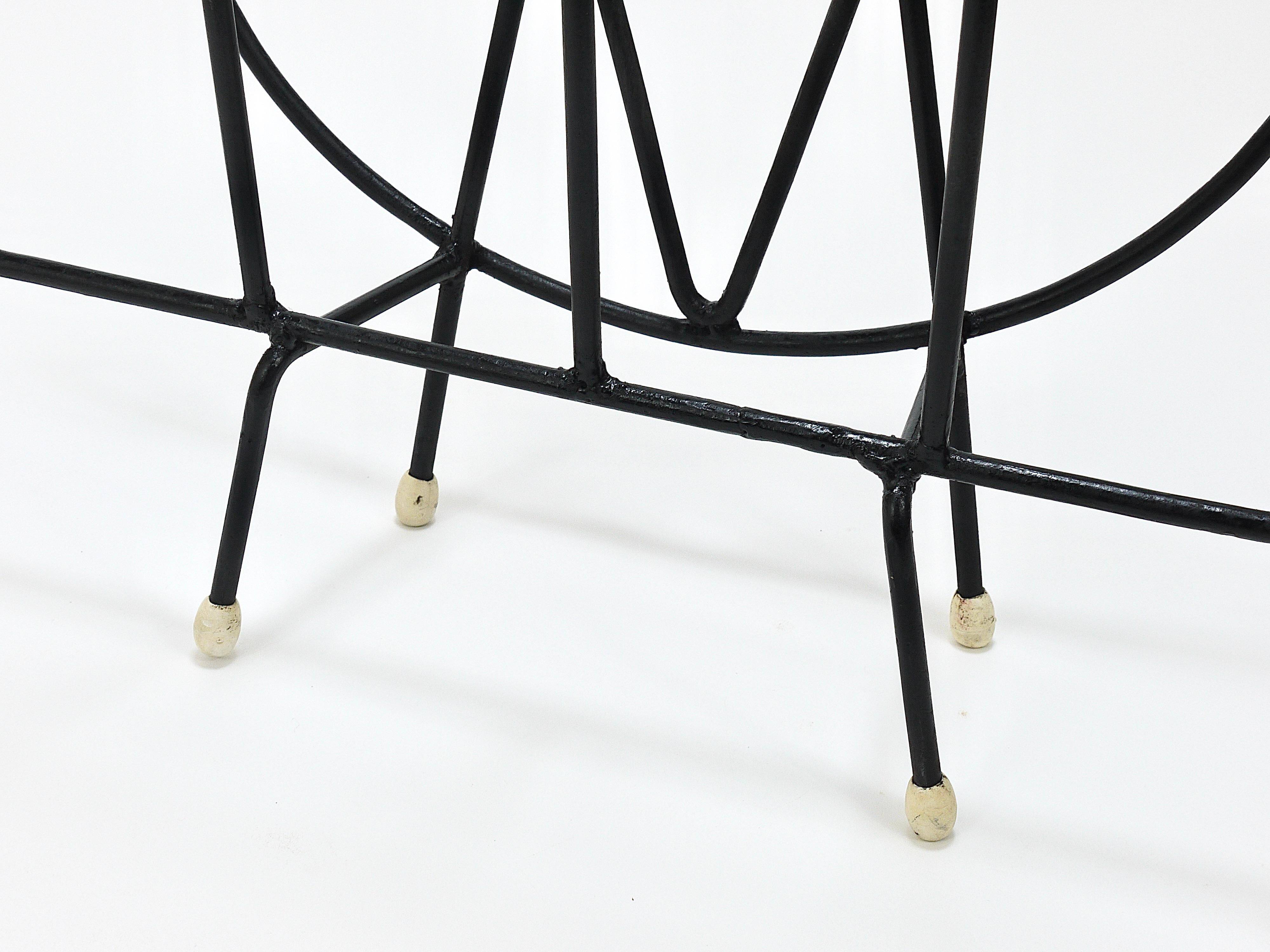 Mid-century cat-shaped magazine or record holder, iron, Italy, 1950s.