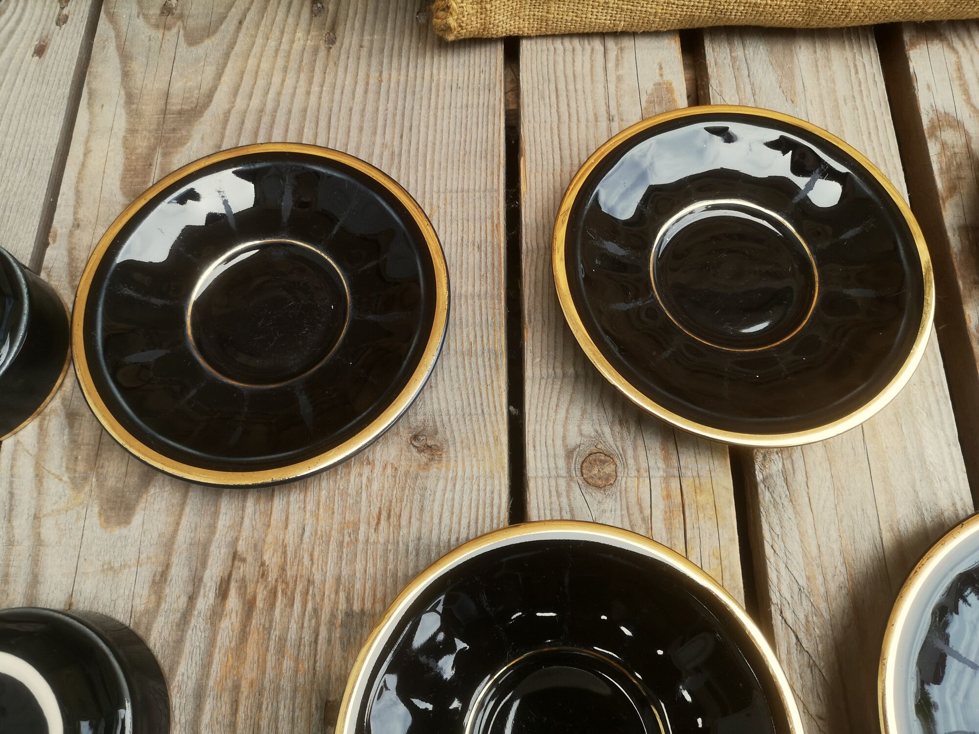 Set of 9 cups and sub-cups in black ceramic and colored gold border