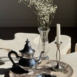 Silver-plated teapot with black handle