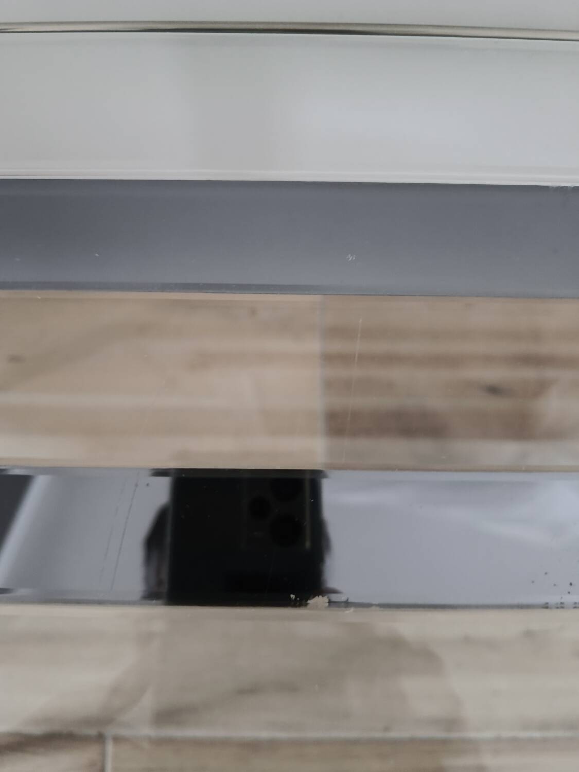 Vintage coffee table in glass and mirror strips.