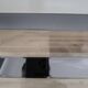 Vintage coffee table in glass and mirror strips.