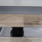 Vintage coffee table in glass and mirror strips.