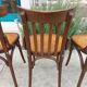 4 bentwood bistro chairs with a pattern on the seat