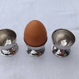 A set of 3 egg cups by Guy Degrenne.