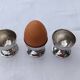 A set of 3 egg cups by Guy Degrenne.