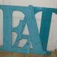 Wooden sign letter O