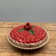 A trompe l’oeil strawberry pie dish