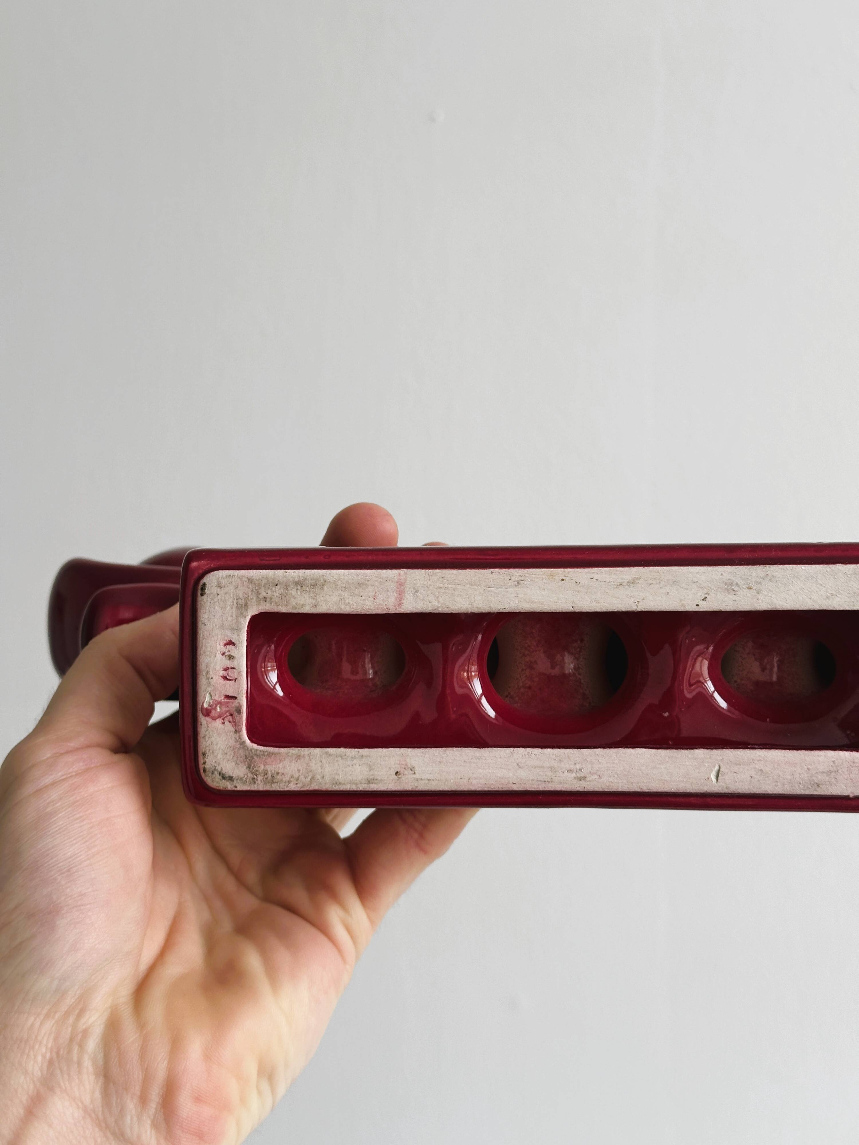 Vintage burgundy red ceramic candlestick