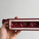 Vintage burgundy red ceramic candlestick