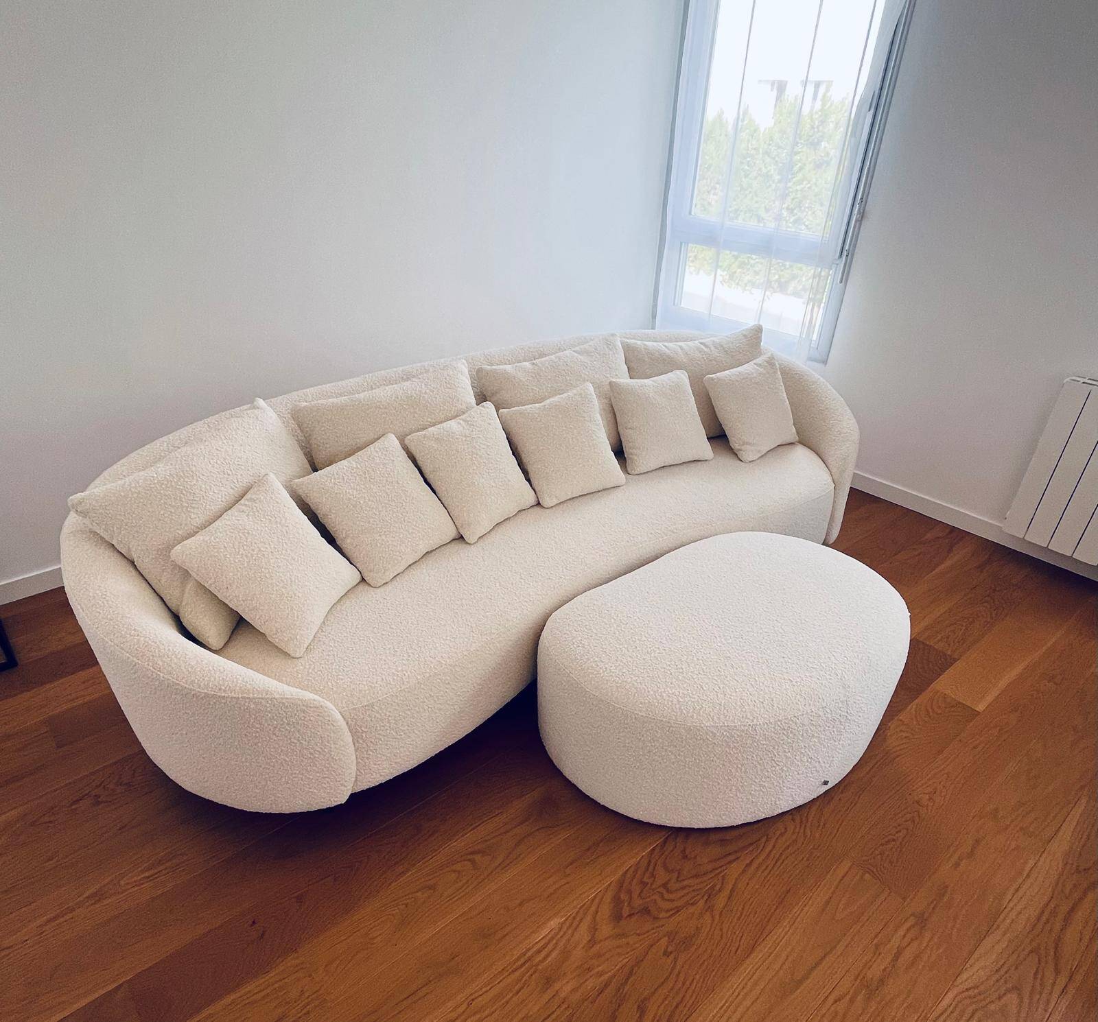 White sofa and pouffe