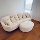 White sofa and pouffe