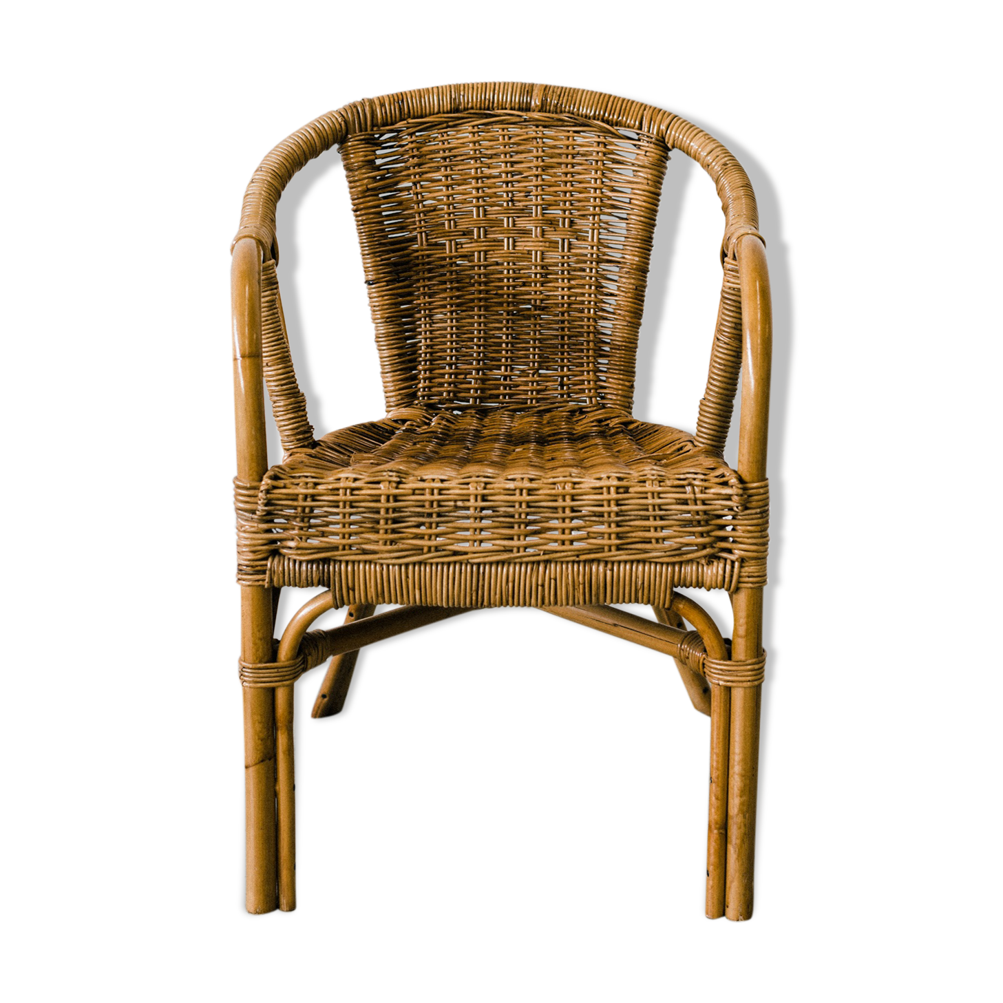 Rattan armchair with armrests