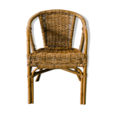 Rattan armchair with armrests