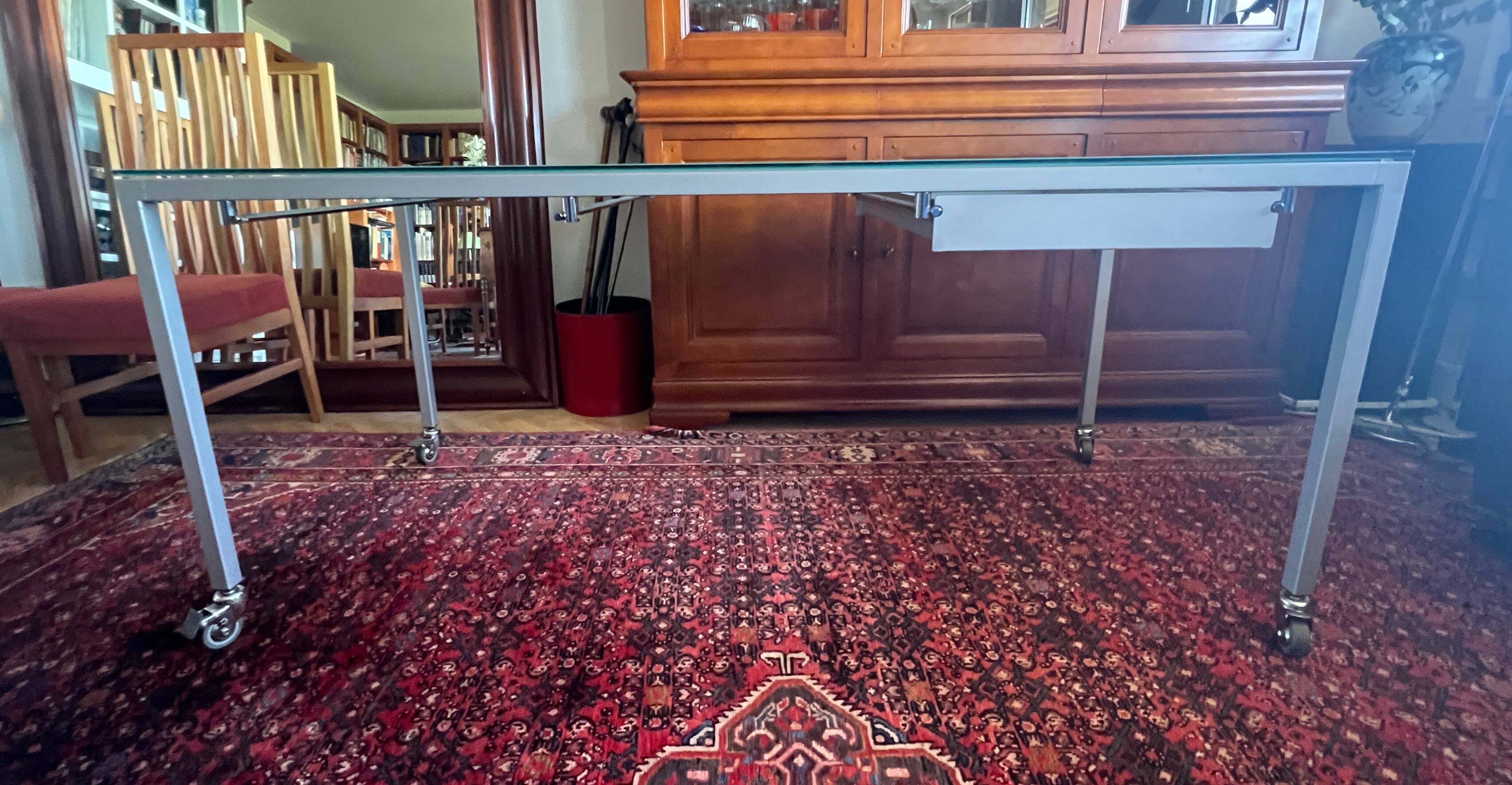 Glass and metal desk with wheels